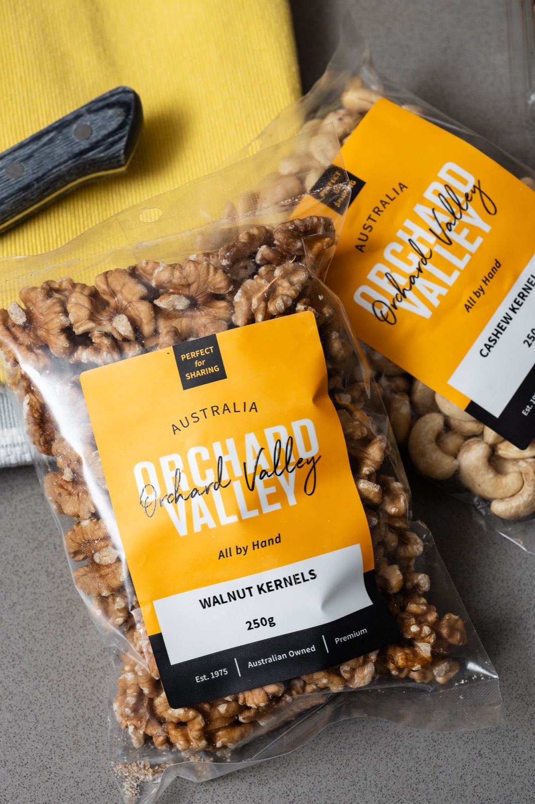 Walnut and cashew packets overhead on the kitchen bench