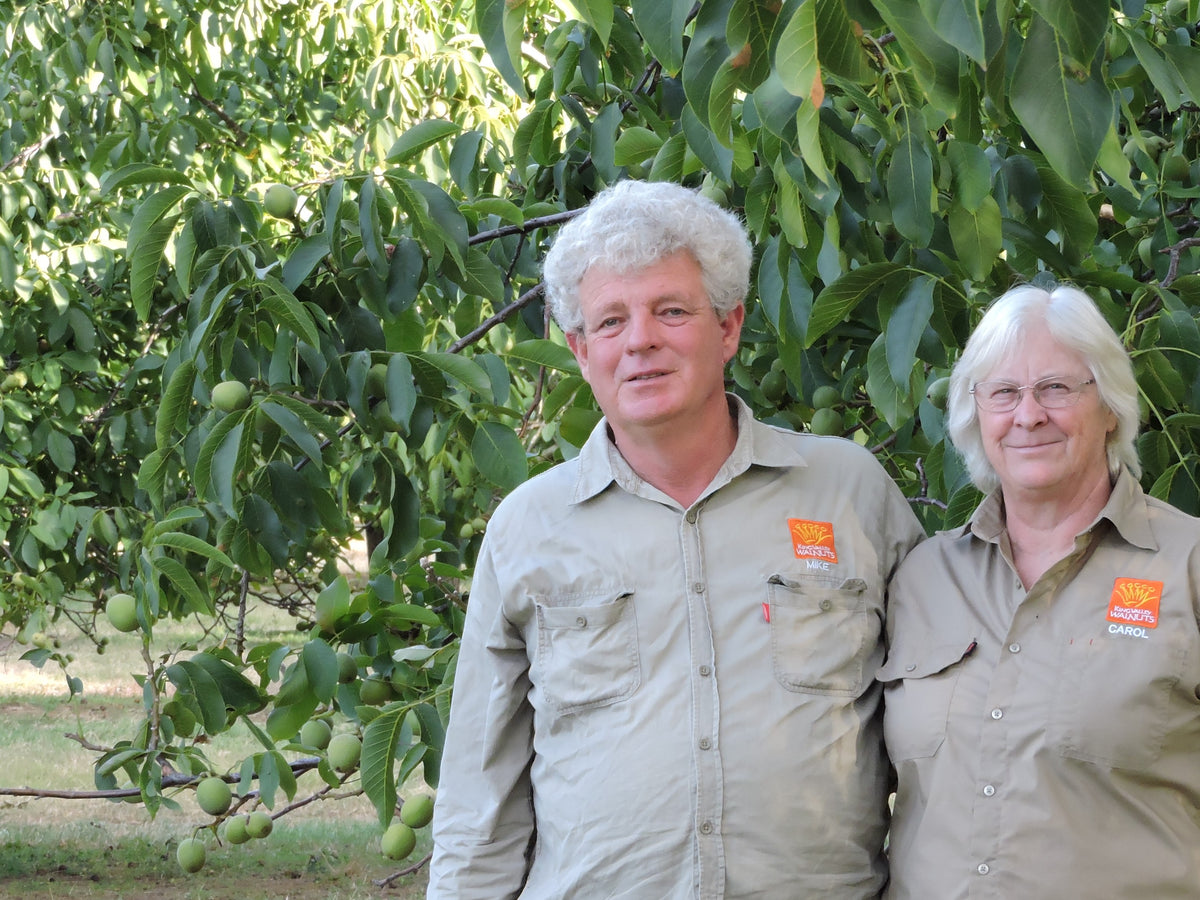 Michael Burston and Carol Kunert in their walnut orchard